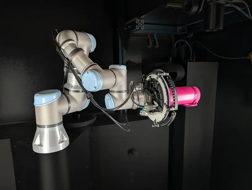 Robot with vacuum gripper holding tumbler